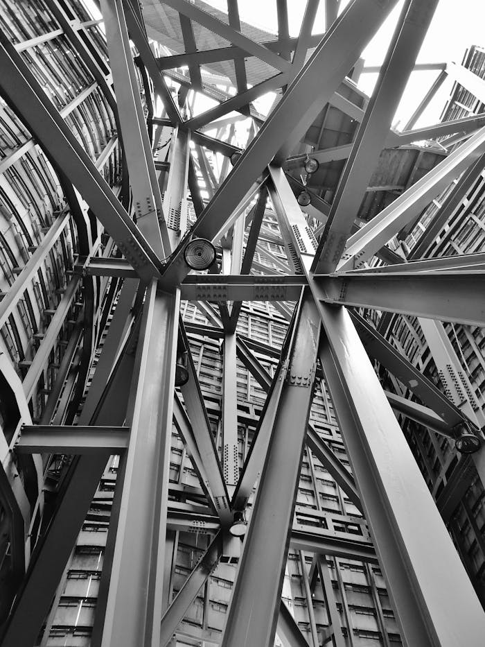 architecture-iron-steel-building-53176 Grayscale Photography of Scafoldings