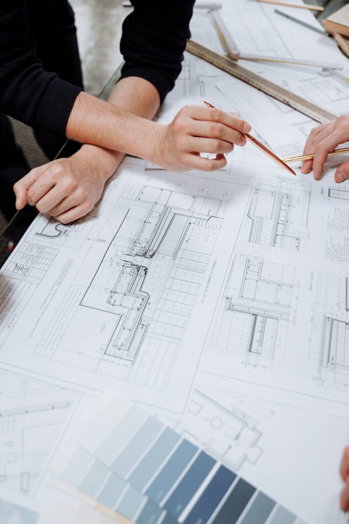 pexels-photo-5584052 Close-Up Photo of an Architect Planning a Schematic Diagram